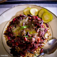 Farro, beet green and kidney bean BBQ stew with cheddar and green onion, homemade pickles